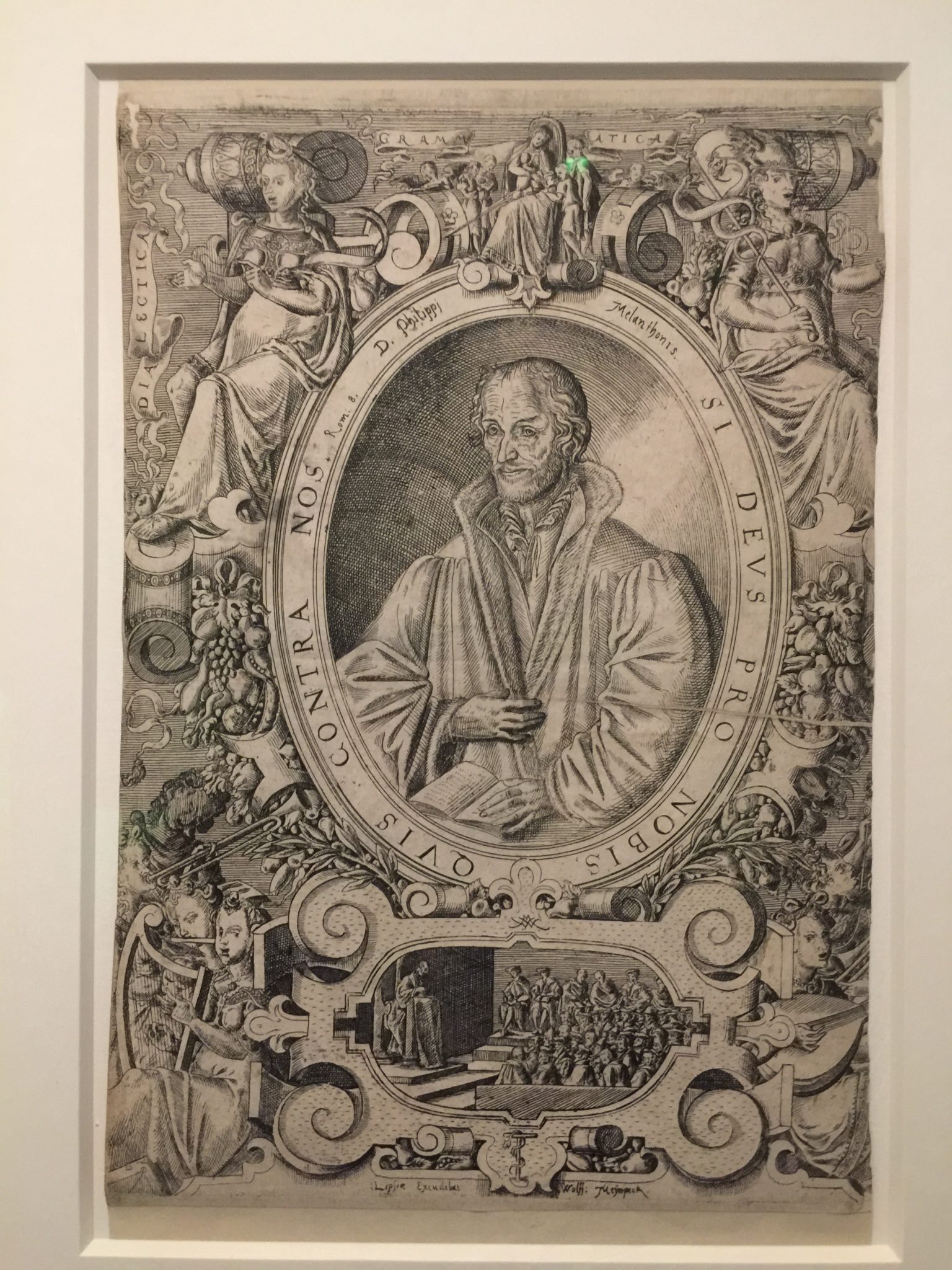 Fellow reformer Melanchthon, framed by his motto, If God is for us, who is against us, Wittenberg